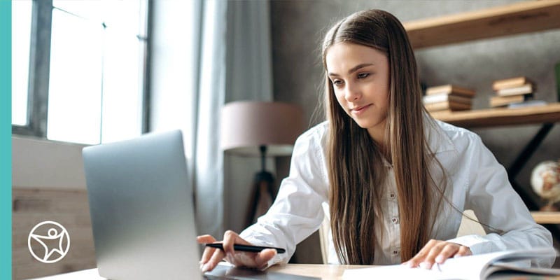 Online school student studying on a laptop